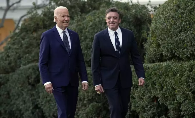 President Joe Biden, left, and Boston Celtics owner Wyc Grousbeck, right, arrive for an event celebrating the Boston Celtics' victory in the 2024 National Basketball Association Championship, on the South Lawn of the White House in Washington, Thursday, Nov. 21, 2024. (AP Photo/Susan Walsh)