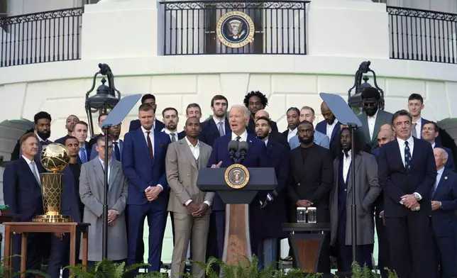 President Joe Biden, center, speaks during an event to welcome the Boston Celtics and celebrate their victory in the 2024 National Basketball Association Championship, on the South Lawn of the White House in Washington, Thursday, Nov. 21, 2024. (AP Photo/Susan Walsh)