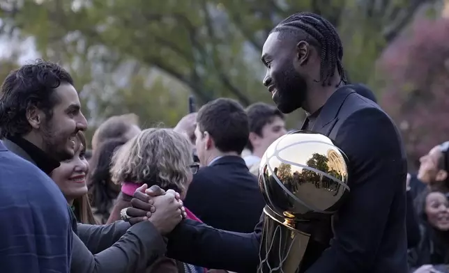 Boston Celtics Jaylen Brown talk with people following an event with President Joe Biden to celebrate the Celtics victory in the 2024 National Basketball Association Championship, on the South Lawn of the White House in Washington, Thursday, Nov. 21, 2024. (AP Photo/Susan Walsh)