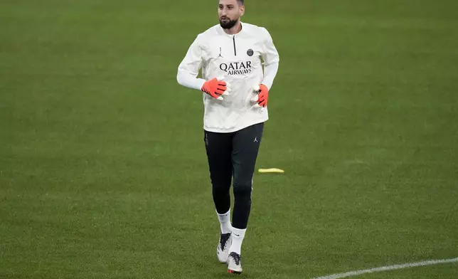 PSG's goalkeeper Gianluigi Donnarumma warms up during a training session in Munich, Germany, Monday, Nov. 25, 2024, ahead of the Champions League opening phase soccer match between FC Bayern and PSG. (AP Photo/Matthias Schrader)