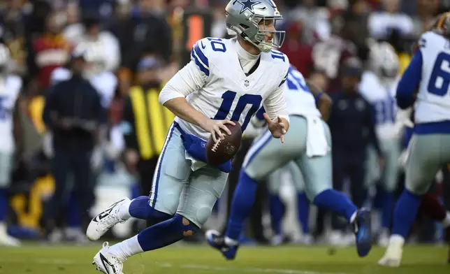 Dallas Cowboys quarterback Cooper Rush (10) looks to pass during the second half of an NFL football game against the Washington Commanders, Sunday, Nov. 24, 2024, in Landover, Md. (AP Photo/Nick Wass)