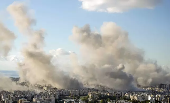 Smoke rises following an Israeli airstrike on Dahiyeh, in Beirut, Lebanon, Tuesday, Nov. 26, 2024. (AP Photo/Bilal Hussein)