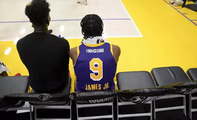 South Bay Lakers guard Bronny James (9) sits on the bench during halftime of an NBA G League basketball game against the Salt Lake City Stars, Saturday, Nov. 9, 2024, in El Segundo, Calif. (AP Photo/Eric Thayer)