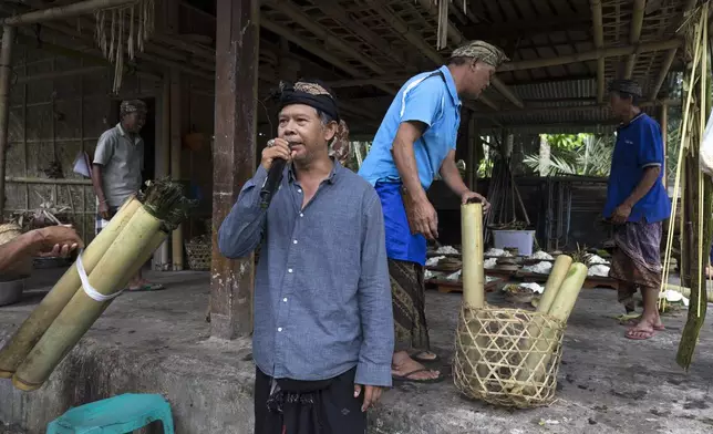 Nyoman Subrata, traditional chief of Geriana Kauh village, thanks villagers for participating in Ngusaba Goreng at Geriana Kauh village, Karangasem, Bali, Indonesia, Thursday, Nov. 21, 2024. (AP Photo/Firdia Lisnawati)