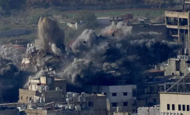 Smoke rises from a building hit in an Israeli airstrike in Dahiyeh, in the southern suburb of Beirut, Lebanon, Thursday, Nov. 14, 2024. (AP Photo/Hussein Malla)