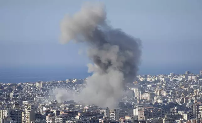 Smoke rises from buildings hit in an Israeli airstrike in Dahiyeh, in the southern suburb of Beirut, Lebanon, Thursday, Nov. 14, 2024. (AP Photo/Hussein Malla)