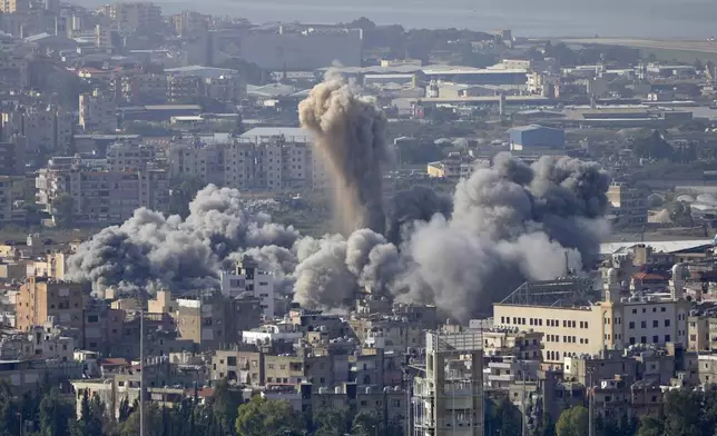 Smoke rises between buildings hit by an Israeli airstrike in Dahiyeh, the southern suburb of Beirut, Lebanon, Thursday, Nov. 14, 2024. (AP Photo/Hussein Malla)