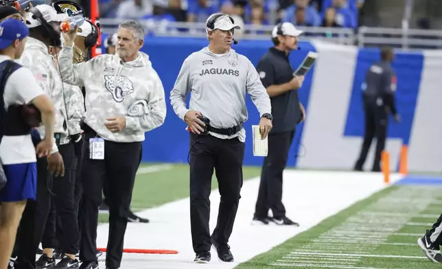 Jacksonville Jaguars head coach Doug Pederson watches against the Detroit Lions during the first half of an NFL football game, Sunday, Nov. 17, 2024, in Detroit. (AP Photo/Duane Burleson)