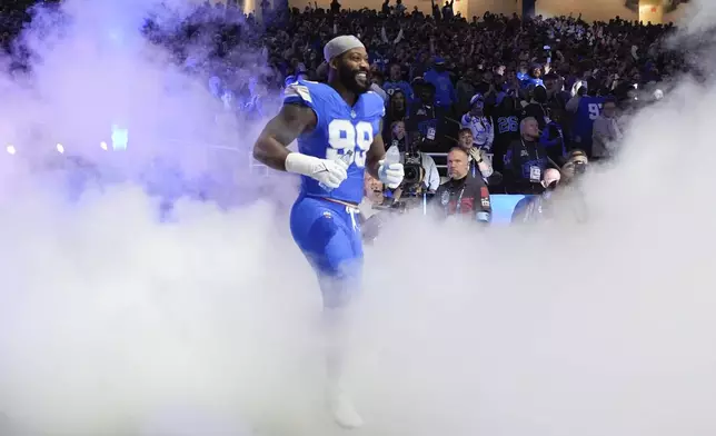 Detroit Lions defensive end Za'Darius Smith (99) is introduced before an NFL football game against the Jacksonville Jaguars, Sunday, Nov. 17, 2024, in Detroit. (AP Photo/Carlos Osorio)