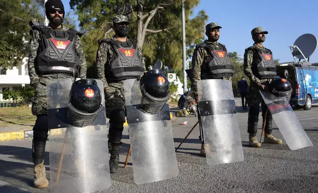 Paramilitary soldiers stand guard along roadside to ensure security in Islamabad, Pakistan, Wednesday, Nov. 27, 2024. (AP Photo/Anjum Naveed)