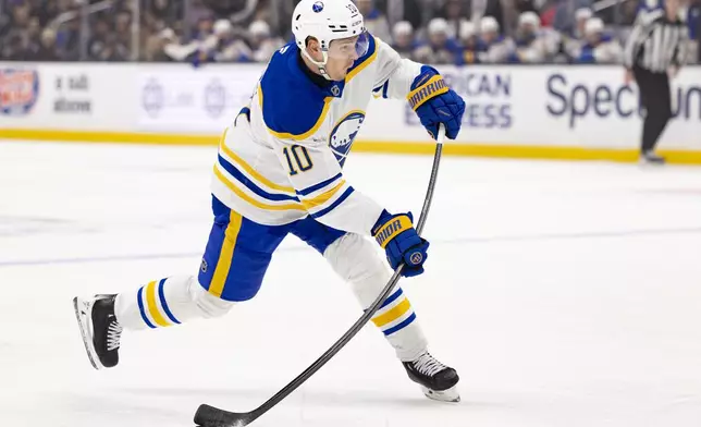 Buffalo Sabres defenseman Henri Jokiharju shoots during the first period of an NHL hockey game against the Los Angeles Kings Wednesday, Nov. 20, 2024, in Los Angeles, Calif. (AP Photo/Ryan Sun)