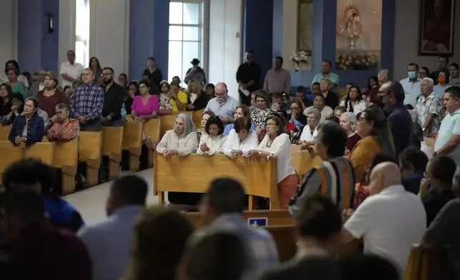 FILE - Parishioners attend Mass at St. Agatha Catholic Church, which has become the spiritual home of the growing Nicaraguan diaspora in Miami, Nov. 5, 2023. (AP Photo/Rebecca Blackwell, File)