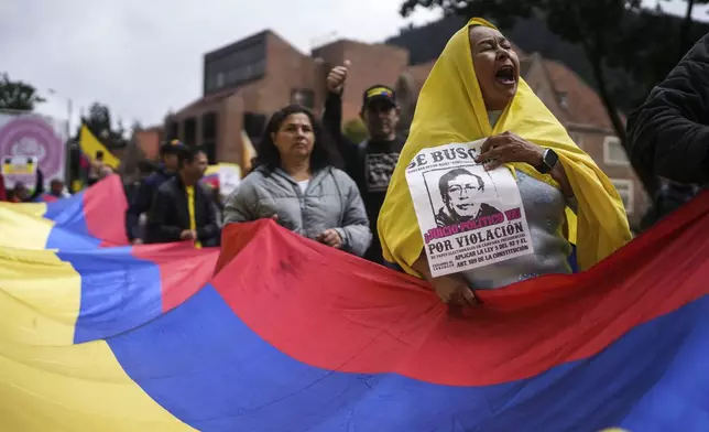 Demonstrators march against the government of President Gustavo Petro, in Bogotá, Colombia, Saturday, Nov. 23, 2024. (AP Photo/Ivan Valencia)