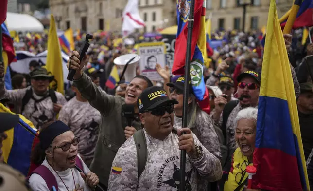 Demonstrators march against the government of President Gustavo Petro, in Bogotá, Colombia, Saturday, Nov. 23, 2024. (AP Photo/Ivan Valencia)