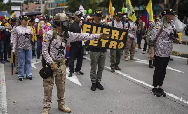 Reservists march against the government of President Gustavo Petro, in Bogotá, Colombia, Saturday, Nov. 23, 2024. (AP Photo/Ivan Valencia)