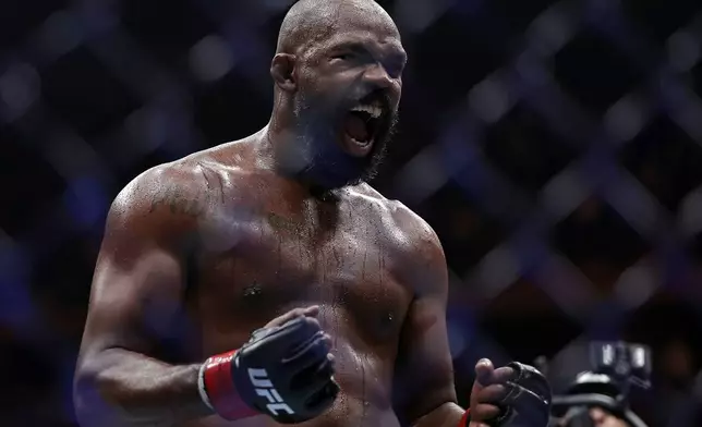 Jon Jones reacts after defeating Stipe Miocic in a UFC 309 mixed martial arts heavyweight title bout, early on Sunday, Nov. 17, 2024, in New York. (AP Photo/Adam Hunger)