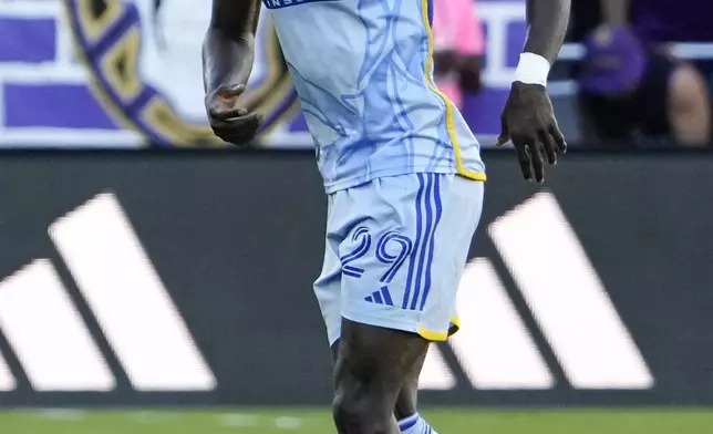 Atlanta United's Jamal Thiare (29) limps off the field after he was injured during the first half of an MLS Semifinal Conference playoff soccer match against Orlando City, Sunday, Nov. 24, 2024, in Orlando, Fla. (AP Photo/John Raoux)