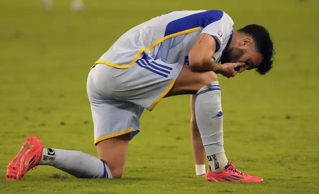 Atlanta United defender Pedro Amador reacts after being eliminated by Orlando City in an MLS Semifinal Conference playoff soccer match, Sunday, Nov. 24, 2024, in Orlando, Fla. (AP Photo/John Raoux)