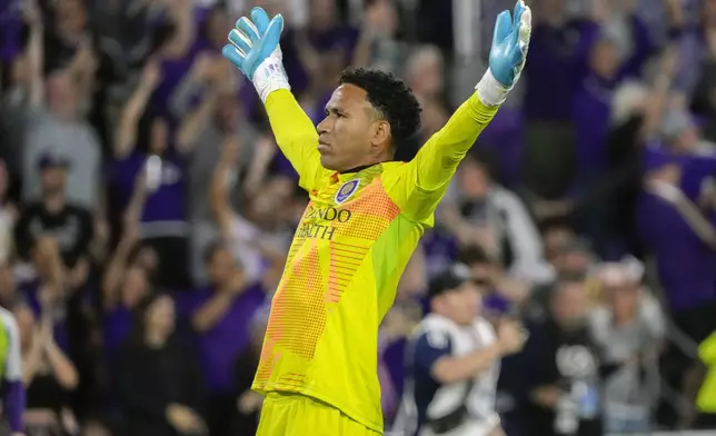 Orlando City goalkeeper Pedro Gallese celebrates in front of fans after defeating Atlanta United in an MLS Semifinal Conference playoff soccer match, Sunday, Nov. 24, 2024, in Orlando, Fla. (AP Photo/John Raoux)