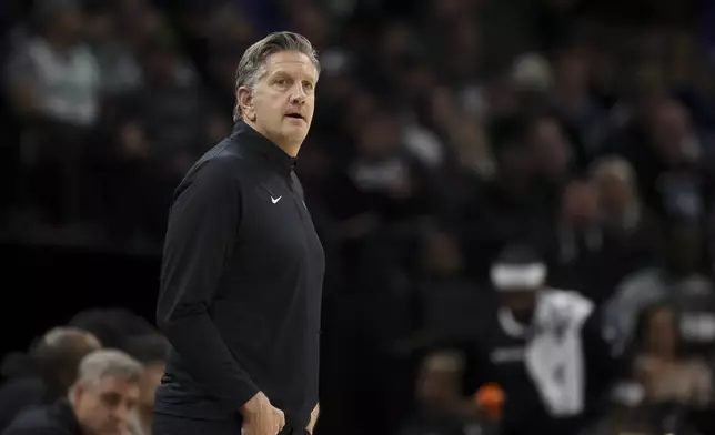 Minnesota Timberwolves head coach Chris Finch watches the action during the first half of an NBA basketball game against the Sacramento Kings, Wednesday, Nov. 27, 2024, in Minneapolis. (AP Photo/Ellen Schmidt)