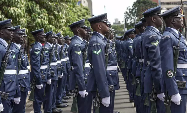 The Kenyan military guard of honour gets ready to welcome President William Ruto, before delivering the State of Nation address at the Parliament buildings in Nairobi, Kenya Thursday, Nov. 21, 2024. (AP Photo/Brian Inganga)