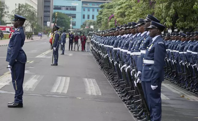 The Kenyan military guard of honour stands in formation to welcome President William Ruto, before delivering the State of Nation address at the Parliament buildings in Nairobi, Kenya Thursday, Nov. 21, 2024. (AP Photo/Brian Inganga)