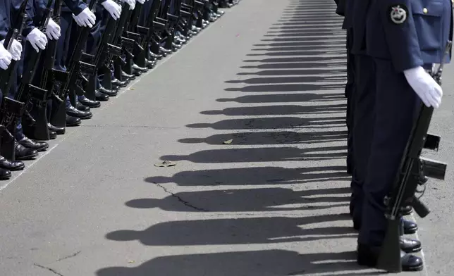 The Kenyan military guard of honour stands in formation to welcome President William Ruto, before delivering the State of Nation address at the Parliament buildings in Nairobi, Kenya Thursday, Nov. 21, 2024. (AP Photo/Brian Inganga)