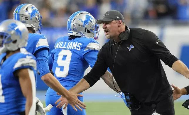 Detroit Lions head coach Dan Campbell talks to players during the first half of an NFL football game against the Jacksonville Jaguars, Sunday, Nov. 17, 2024, in Detroit. (AP Photo/Carlos Osorio)