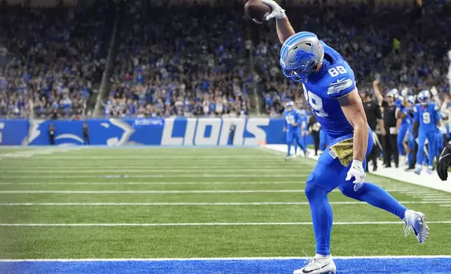 Detroit Lions tight end Brock Wright (89) celebrates his five-yard touchdown reception against the Jacksonville Jaguars during the first half of an NFL football game, Sunday, Nov. 17, 2024, in Detroit. (AP Photo/Carlos Osorio)