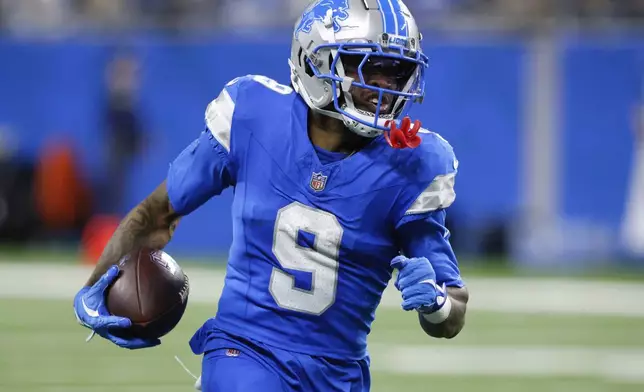 Detroit Lions wide receiver Jameson Williams (9) catches a 64-yard touchdown pass against the Jacksonville Jaguars during the second half of an NFL football game, Sunday, Nov. 17, 2024, in Detroit. (AP Photo/Duane Burleson)