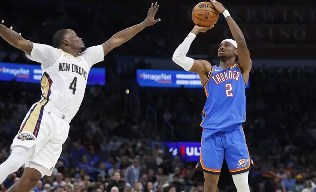 Oklahoma City Thunder guard Shai Gilgeous-Alexander (2) shoots over New Orleans Pelicans guard Javonte Green (4) during the first half of an NBA basketball game Wednesday, Nov. 13, 2024, in Oklahoma City. (AP Photo/Nate Billings)