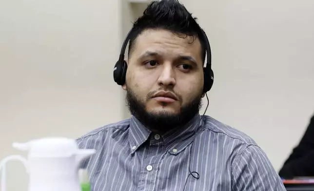 Jose Ibarra listens through an interpreter during the second day of his trial at the Athens-Clarke County Superior Court on Monday, Nov. 18, 2024, in Athens, Ga. (Miguel Martinez/Atlanta Journal-Constitution via AP, Pool)