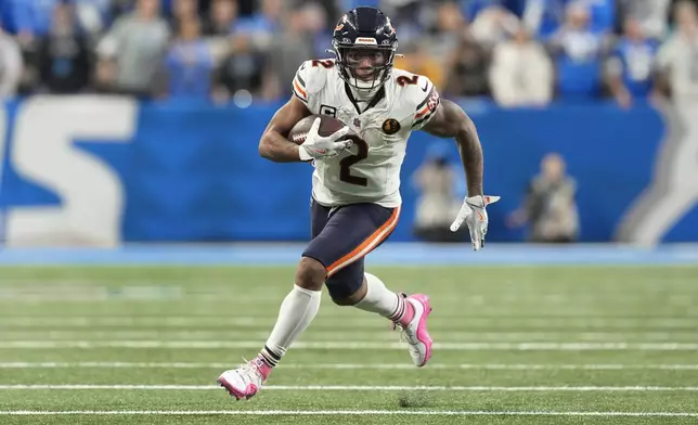 Chicago Bears wide receiver DJ Moore (2) runs after a catch against the Detroit Lions during the second half of an NFL football game in Detroit, Thursday, Nov. 28, 2024. (AP Photo/Carlos Osorio)