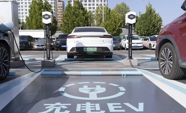 A electric vehicle charging station is seen in Beijing, Friday, Oct. 11, 2024. (AP Photo/Caroline)