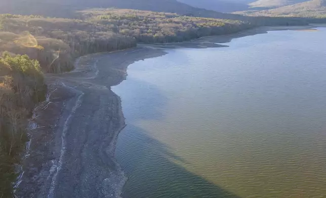 Dropping water levels expose the lake bed at the Ashokan Reservoir in Ulster County, New York, on Wednesday, Nov. 13, 2024. (AP Photo/Ted Shaffrey)