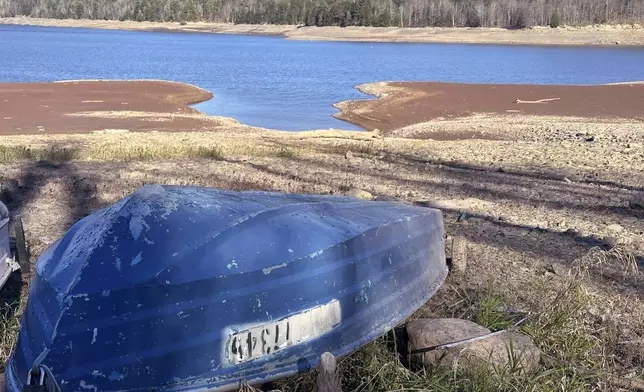 Boats are stored at a public access point for the Schoharie Reservoir, in Gilboa, N.Y., Wednesday, Nov. 13, 2024. New York City officials are concerned about low water levels in their network of upstate New York reservoirs. (AP Photo/Michael Hill)