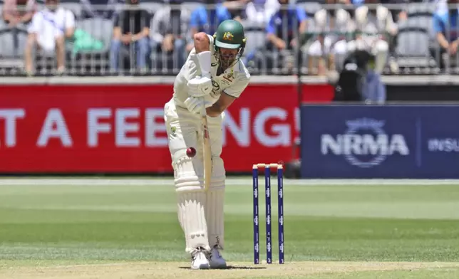 Australia's Mitchell Starc bats on the second day of the first cricket test between Australia and India in Perth, Australia, Saturday, Nov. 23, 2024. (AP Photo/Trevor Collens)