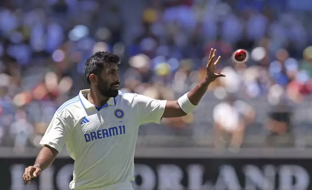 India's captain Jasprit Bumrah collects the ball as he prepares to bowl on the second day of the first cricket test between Australia and India in Perth, Australia, Saturday, Nov. 23, 2024. (AP Photo/Trevor Collens)