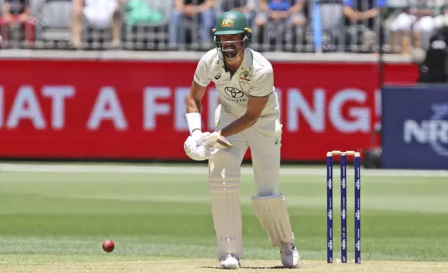 Australia's Mitchell Starc bats on the second day of the first cricket test between Australia and India in Perth, Australia, Saturday, Nov. 23, 2024. (AP Photo/Trevor Collens)