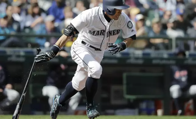 FILE - Seattle Mariners' Ichiro Suzuki heads to first base after hitting a single against the Cleveland Indians during the third inning of a baseball game March 31, 2018, in Seattle. (AP Photo/Ted S. Warren, File)