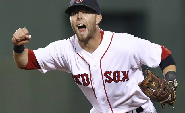 FILE - In this Aug. 16, 2011, file photo, Boston Red Sox second baseman Dustin Pedroia celebrates the completion of a triple play against the Tampa Bay Rays during the fourth inning of the second baseball game of a doubleheader in Boston. (AP Photo/Elise Amendola, File)