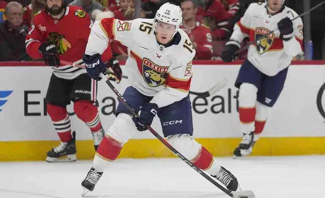 Florida Panthers center Anton Lundell (15) shoots the puck during the first period of an NHL hockey game against the Chicago Blackhawks, Thursday, Nov. 21, 2024, in Chicago. (AP Photo/Erin Hooley)