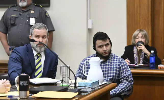 Jose Ibarra, accused of killing a Georgia nursing student earlier this year, listens through an interpreter as he sits with his attorney Dustin Kirby, left, during his trial at Athens-Clarke County Superior Court, Friday, Nov. 15, 2024, in Athens, Ga. (Hyosub Shin/Atlanta Journal-Constitution via AP, Pool)