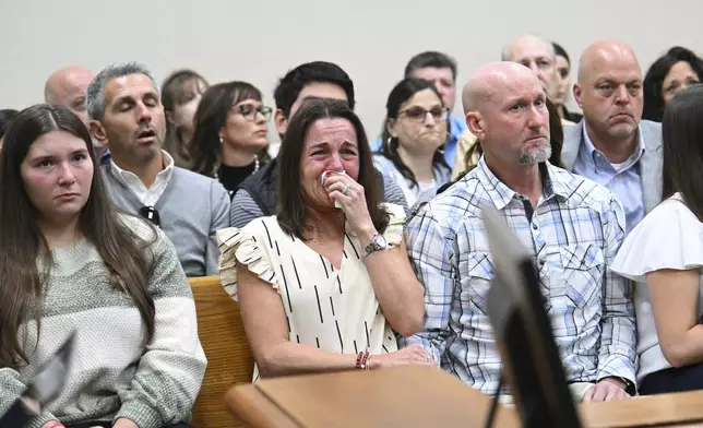 Allyson Phillips, second from left, mother of Jose Ibarra, accused of killing a Georgia nursing student earlier this year, reacts as John Phillips, stepfather of Jose Ibarra, comforts her during a trial of Jose Ibarra at Athens-Clarke County Superior Court, Friday, Nov. 15, 2024, in Athens, Ga. (Hyosub Shin/Atlanta Journal-Constitution via AP, Pool)