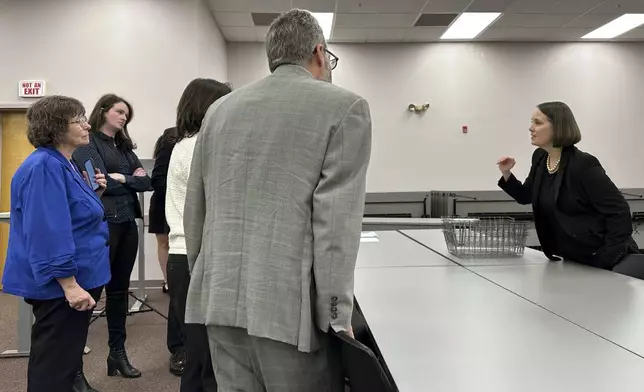 Maine Secretary of State Shenna Bellows , right, addresses attorneys and campaign staffers as election workers scan ballots for ranked choice voting, Tuesday, Nov. 12, 2024, in Augusta, Maine. (AP Photo/David Sharp)