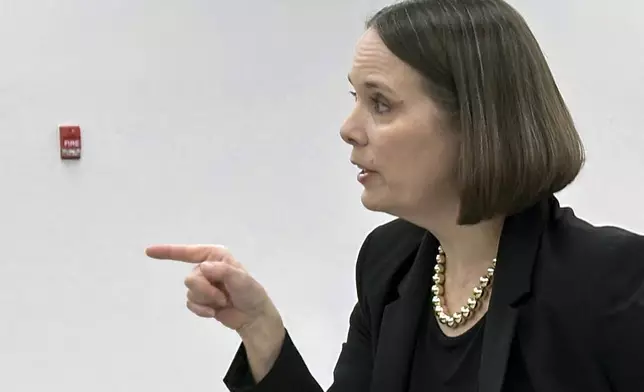 Maine Secretary of State Shenna Bellows addresses attorneys and campaign staffers as election workers scan ballots for ranked choice voting, Tuesday, Nov. 12, 2024, in Augusta, Maine. (AP Photo/David Sharp)