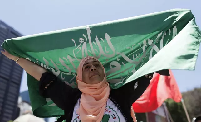 A demonstrator shows solidarity with the Palestinian people as leaders meet at the G20 summit in Rio de Janeiro, Monday, Nov. 18, 2024. (AP Photo/Bruna Prado)