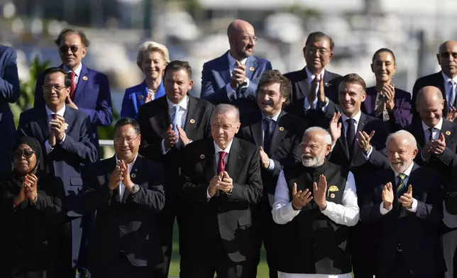 Leaders attending the G20 Summit pose for a group photo in Rio de Janeiro, Monday, Nov. 18, 2024. (AP Photo/Eraldo Peres)