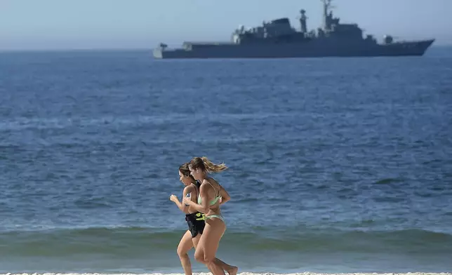 A Brazilian Navy ship patrols off Copacabana beach during the G20 Summit in Rio de Janeiro, Monday, Nov. 18, 2024. (AP Photo/Dhavid Normando)