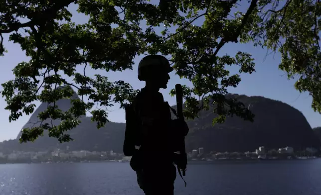 A soldier patrols the perimeters of the Museum of Modern Art, the venue of the G20 summit in Rio de Janeiro, Monday, Nov. 18, 2024. (AP Photo/Bruna Prado)